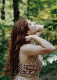 a woman posing in the woods