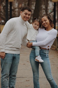 a family posing for a photo in a park