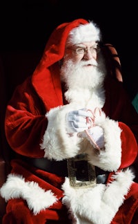 a santa claus sitting on a train