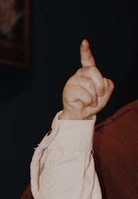 a child is pointing at something with his finger