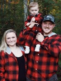 a family wearing red and black plaid flannel shirts