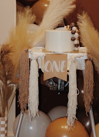 a baby's first birthday party with balloons and decorations